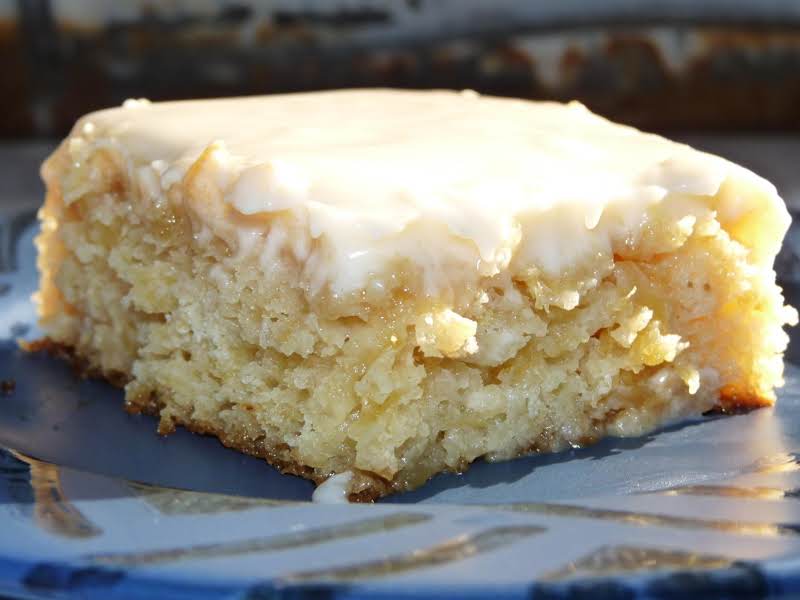 Moist pineapple cake topped with cream cheese frosting